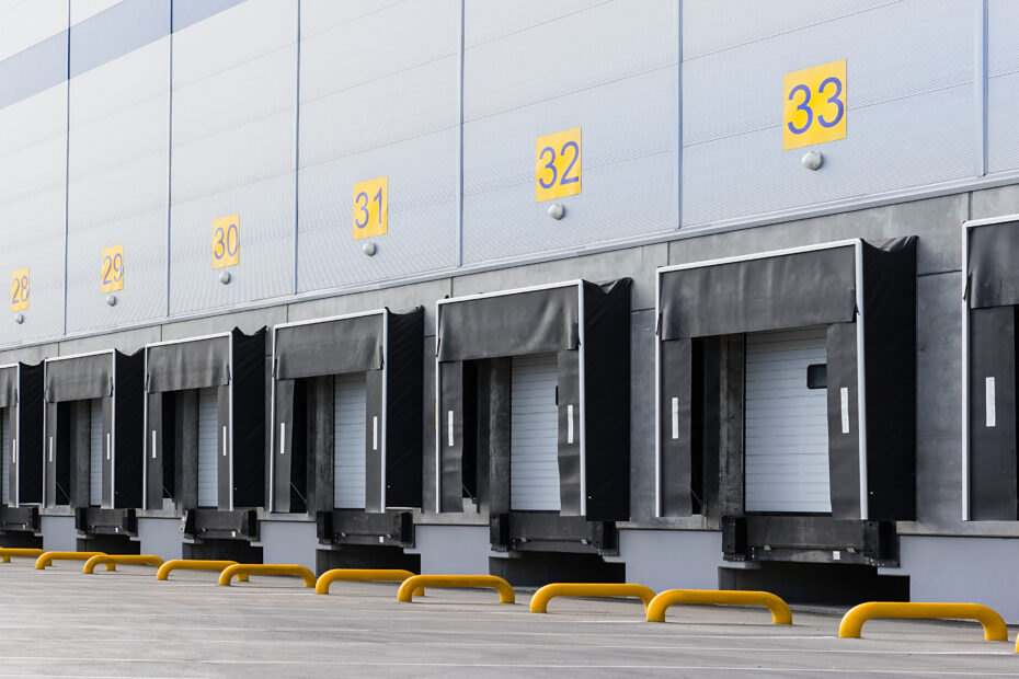 Entrance ramps of a large distribution warehouse with gates for loading goods